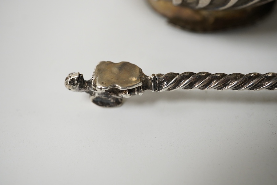 A small French white metal hot water pot, 13cm, a continental white metal bowl (a.f.) and a 19th century German white metal spoon. Condition - poor to fair